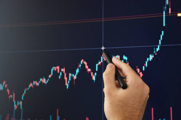 istock Stock market and cryptocurrency trader analyzing data on the computer monitor 1353681828
