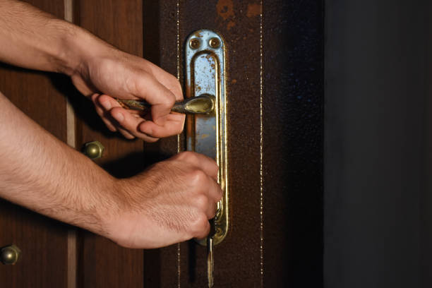 Male hand holding door handle and he is opening or closed the door