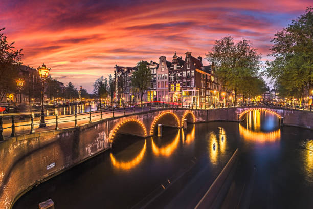 beautiful view of amsterdam canals with bridge and typical dutch houses. holland view of keizersgracht and famous touristic place - amsterdam holland city night imagens e fotografias de stock