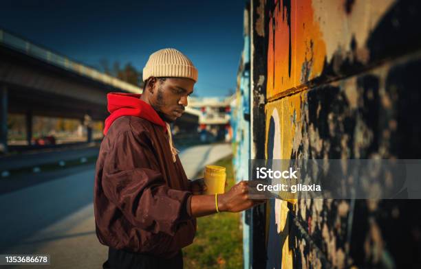 Street Artist Drawing Graffiti On The Wall Stock Photo - Download Image Now - Graffiti, Painting - Activity, African Ethnicity