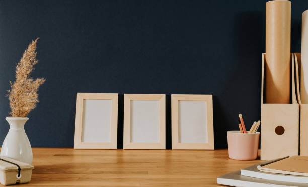 istock Set of three frames on office desk 1353686737
