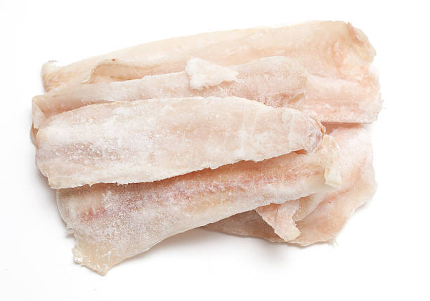 frozen pollock frozen pollock isolated haddock stock pictures, royalty-free photos & images