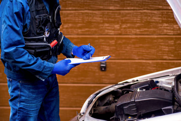 istock Car mechanic analyzes a car breakdown stock photo 1353691415