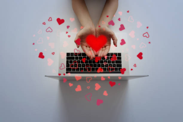 istock Woman holding heart shapes 1353691576