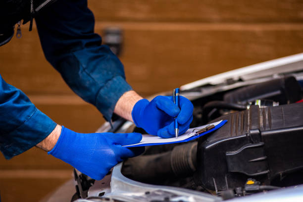 istock Car mechanic analyzes a car breakdown stock photo 1353691585