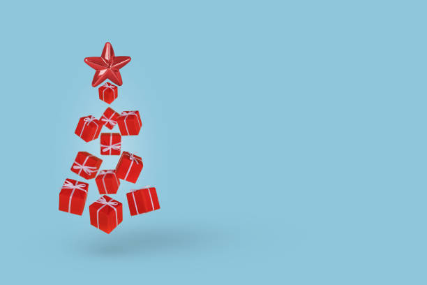 istock Christmas tree made of gift boxes and decorative star on  light blue background. 1353692288