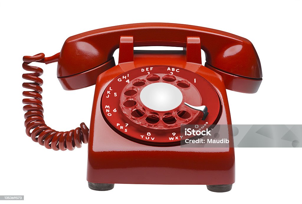 Red phone, isolated Red  60s rotary dial phone on white, isolated with clipping path Telephone Stock Photo