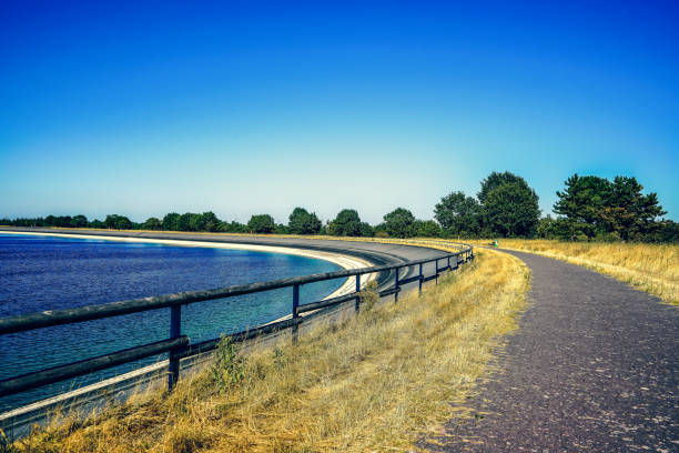 istock A path next to a water reservoir in summer in Germany. 1353697128