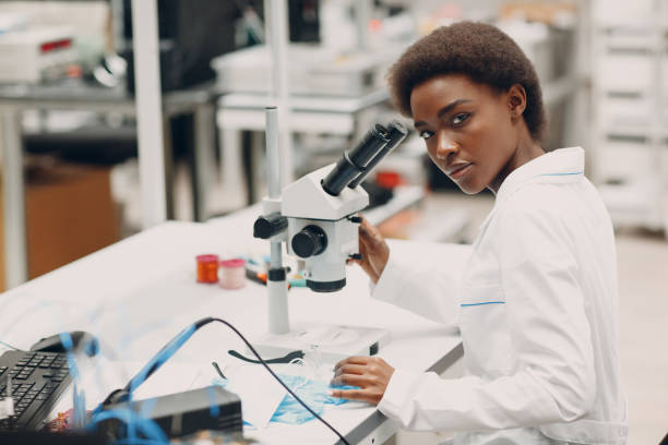 istock Scientist african american woman working in laboratory with electronic instruments 1353699575