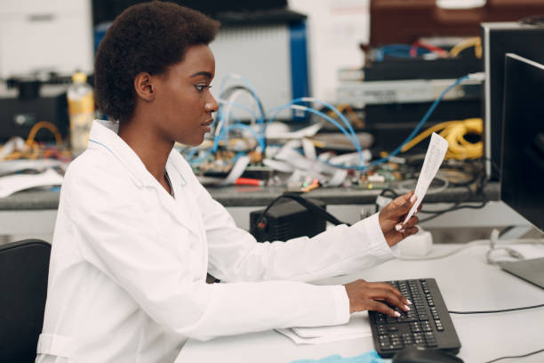 istock Scientist african american woman working in laboratory with electronic instruments 1353699577