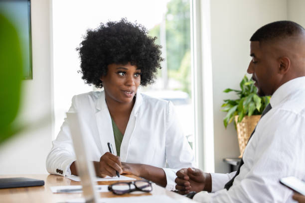 istock Serious Woman sitting  in meeting 1353699961