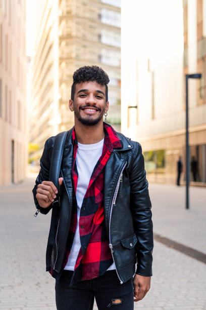 istock young latin student smiling happy in the city 1353700516