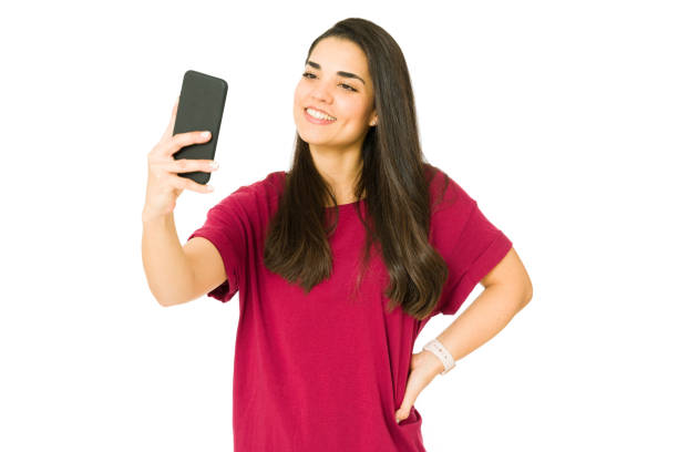istock Influencer recording a video with her phone 1353704691