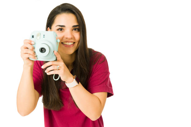 istock Portrait of a woman using a camera 1353704695