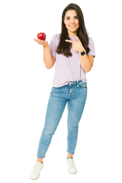 Gorgeous woman eating an apple