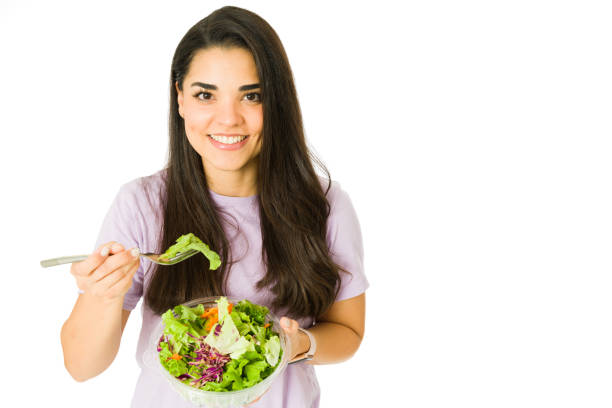 istock Happy woman with a healthy diet 1353704910