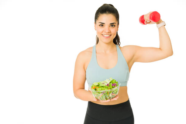 istock Cheerful woman on a healthy diet 1353706024