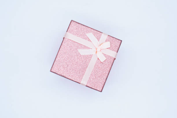 istock Christmas gift box with a ribbon for congratulations on white background. Gift box for Christmas, New Year or Valentine's Day 1353708372