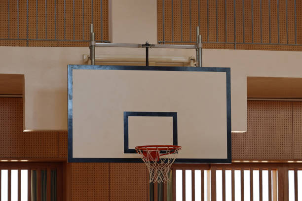 istock Gymnasium basketball ring and backboard 1353708663