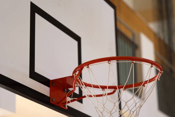 istock Gymnasium basketball ring and backboard 1353708667