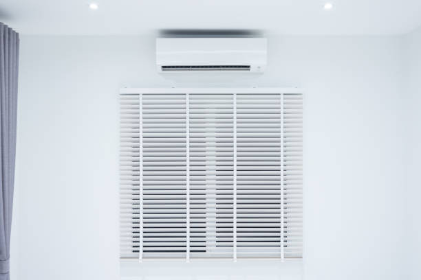 istock Air conditioner and adjusting vertical or venetian blinds. 1353713262