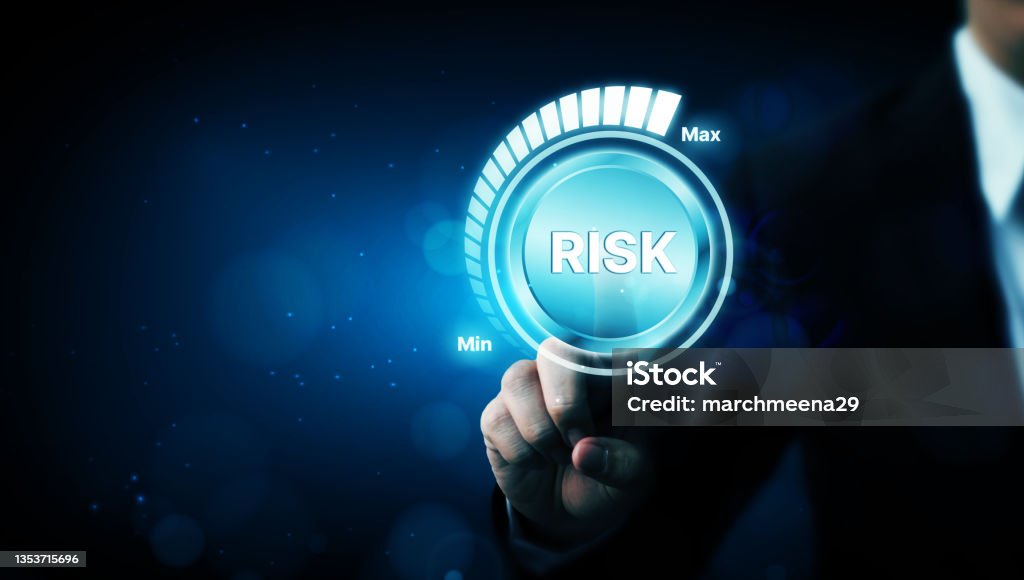 Risk management business strategy planning concept. Businessman hand pointing risk level Risk Stock Photo