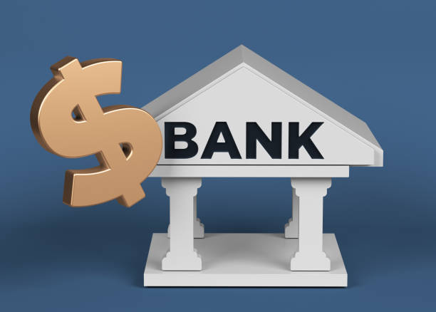 istock Gold-colored Dollar symbol and white-colored bank icon. 1353722052