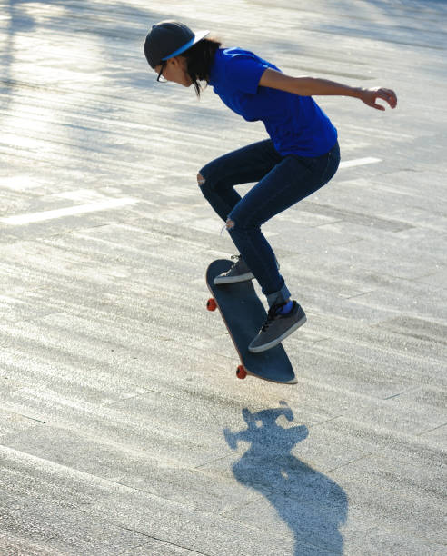 istock Skateboarder skateboarding outdoors in city 1353728845