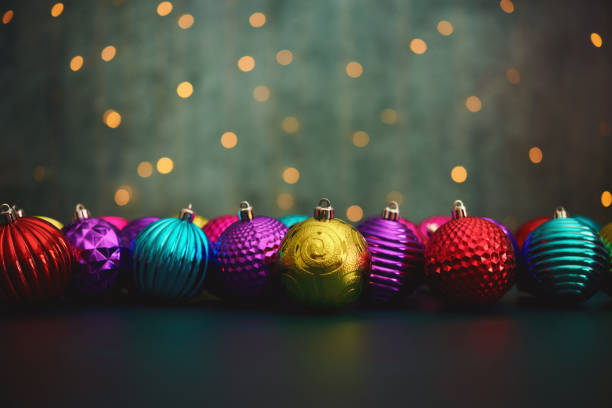 istock Vibrant Christmas Decorations with Christmas String Lights and Green Background 1353728927