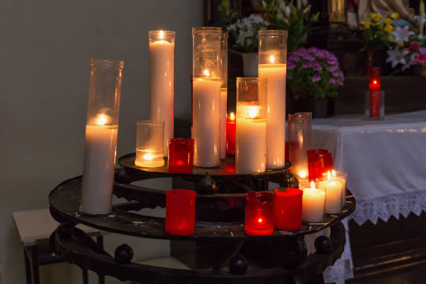 istock Traditional burning candles in catholic church. 1353731373