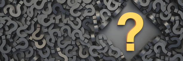 istock Yellow question mark on a background of black signs 1353731828