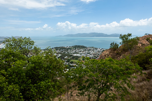 View from a mountain top out across township and towards the ocean and islands