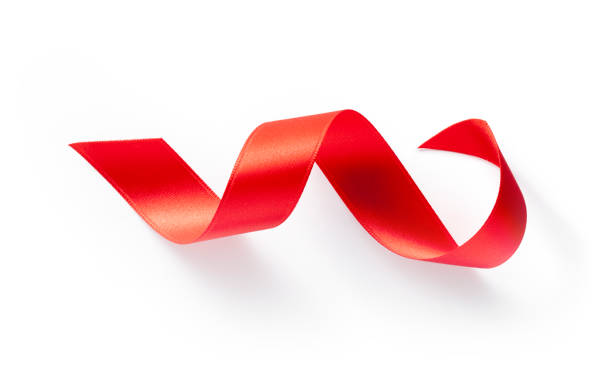 ruban de soie rouge - aids awareness ribbon ribbon red swirl photos et images de collection