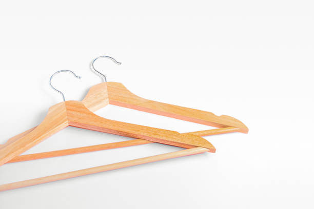 istock Two wooden clothes hangers on a white background. Flat lay, copy space, horizontal background. Clothes hangers , shopping concept, sales 1353738637