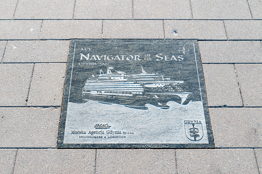 Gdynia, Poland - August 1, 2021: Plaque of Navigator of the Seas at Passenger Ships Alley visiting Gdynia.