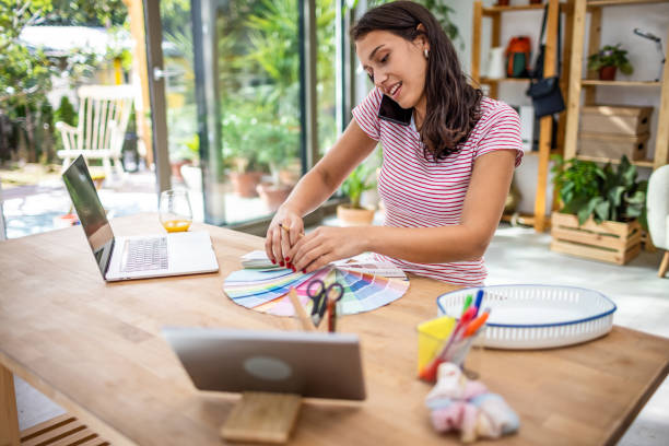 istock Young woman working from home office 1353742747