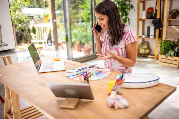istock Young woman working from home office 1353742780