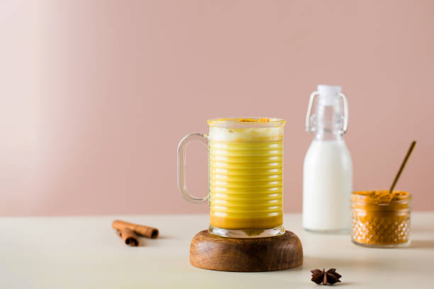 istock Latte turmeric on a pink background. Moon milk for better sleep. Ayurvedic drink. Copy space. 1353743955