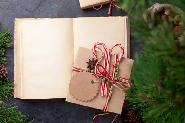 istock Christmas gift box with craft decor and vintage book 1353747045