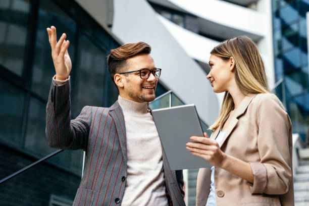 istock Successful business colleagues people working together on digital devices. 1353747860