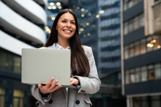 Beautiful business professional woman in the city outdoor. Business work people lifestyle concept stock photo