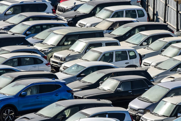 istock Many cars parked and distributed in rows 1353750166
