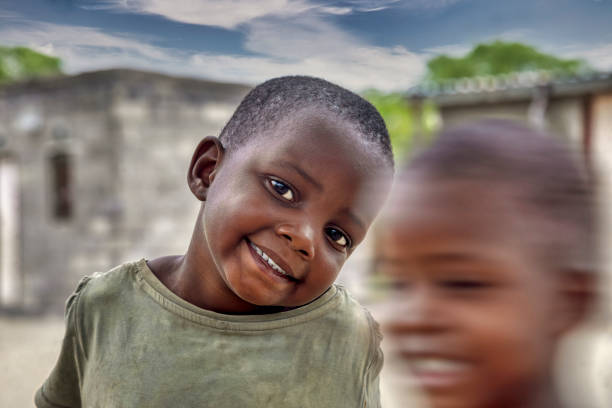 African American boy smiling looking at camera.