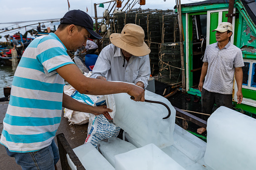 Hoi An, Quang Nam, Vietnam - December 15, 2019: An ice crusher at the fish market of Hoi An in Vietnam,