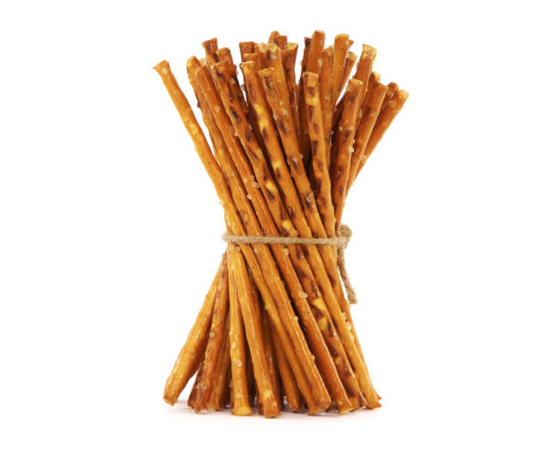 istock Pretzel sticks with salt tied with string, isolated on a white 1353757385