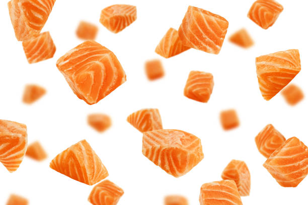 istock Falling raw salmon, fish isolated on white background, selective focus 1353758279