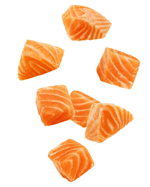 Falling raw salmon, fish isolated on white background, clipping path, full depth of field