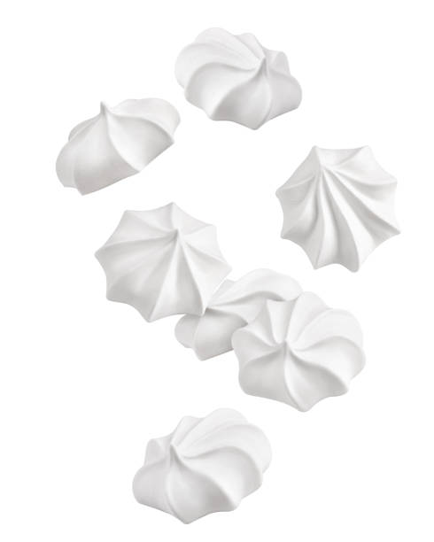 Falling meringue, zephyr, marshmallow, isolated on white background, clipping path, full depth of field Falling meringue, zephyr, marshmallow, isolated on white background, clipping path, full depth of field meringue stock pictures, royalty-free photos & images