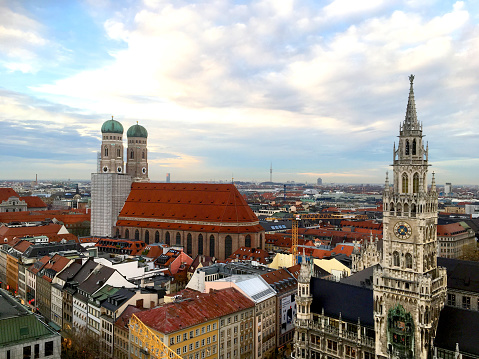 The new city hall, the Frauenkirche and city skyline from Marienplatz in Munich, Bavaria, Germany on a a clear day.