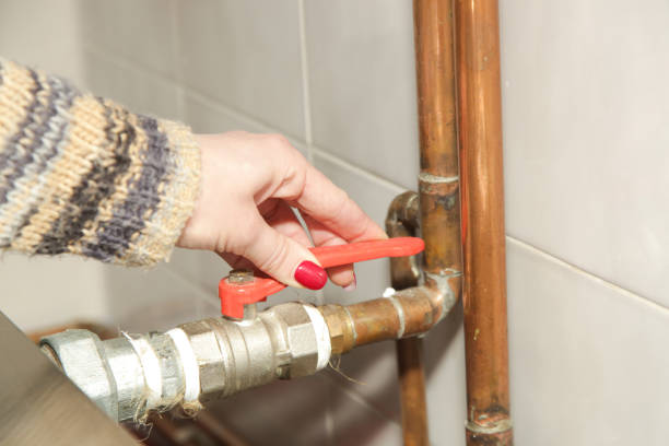 istock A part of central heating system. Woman hand adjusting valve for home heating. 1353758949